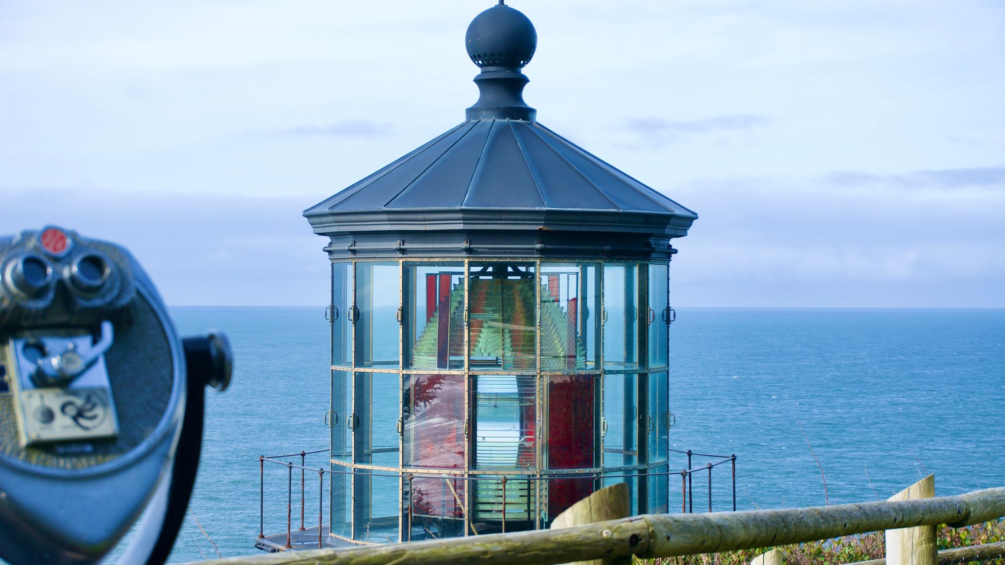 Cape Meares Lighthouse stands above the Pacific Ocean at a viewpoint in coastal Oregon